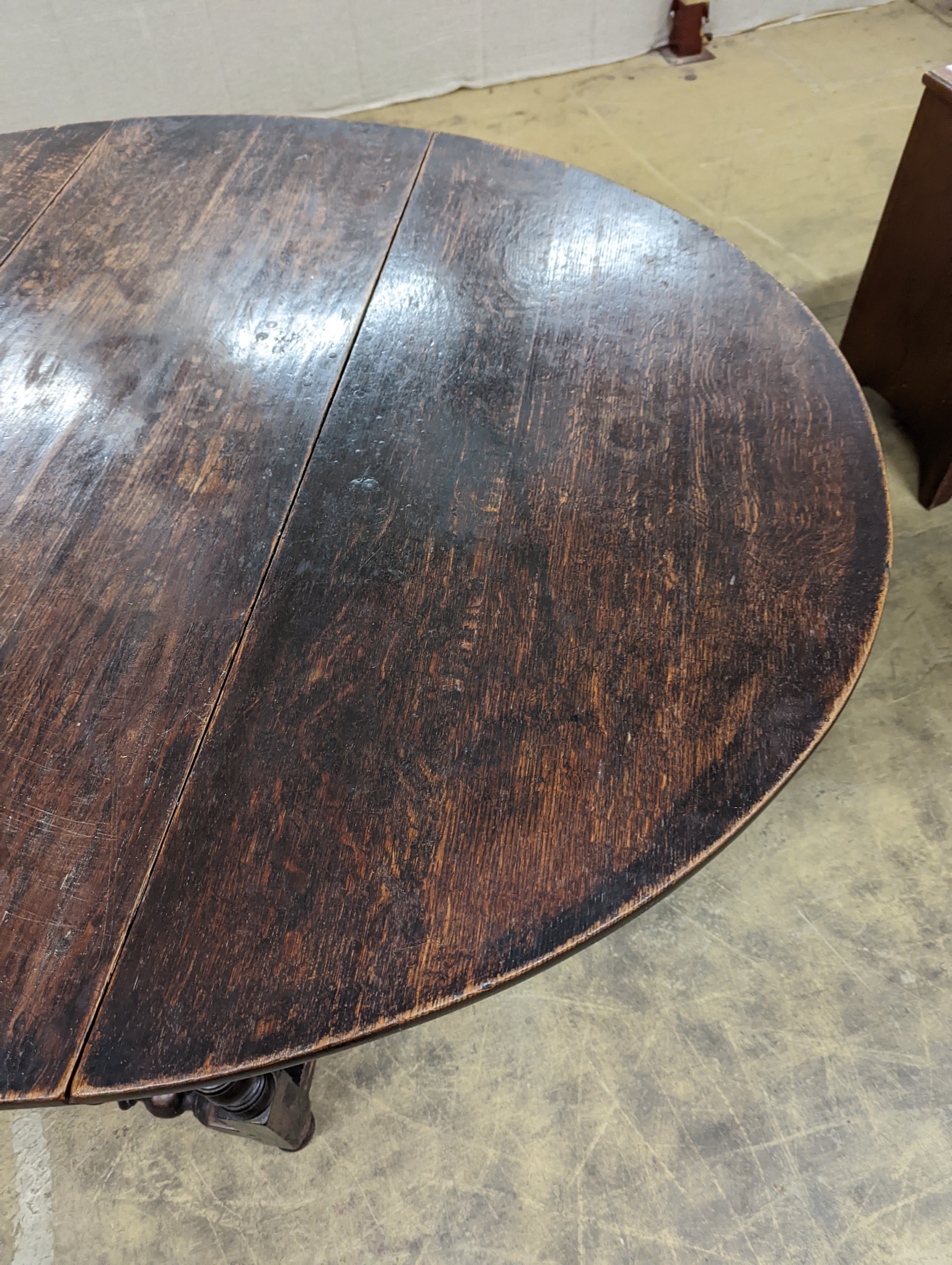 An 18th century oak gateleg table, length 146cm extended, depth 119cm, height 74cm